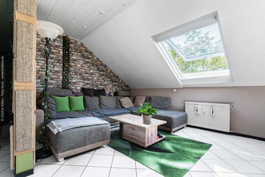 Wohnzimmer Dachgeschoss Mehrfamilienhaus Neu-Isenburg