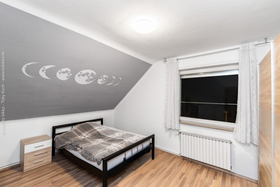 Schlafzimmer DG Mehrfamilienhaus Langen (Hessen)